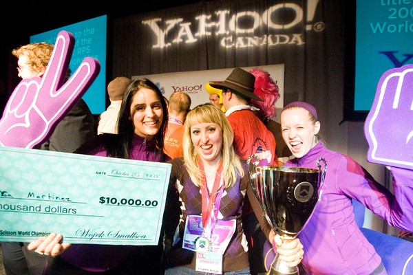 New Yahoo! Rock, Paper, Scissors World Champion Monica Martinez celebrates her win in Toronto after being awarded the Championship trophy and a cheque for $10,000. 